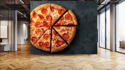 Tasty pepperoni pizza and cooking ingredients tomatoes basil on black concrete background. Top view of hot pepperoni pizza. With copy space for text. Flat lay Wall mural