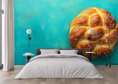 Top view of golden braided challah bread on a vibrant blue background, banner with copy space Wall mural