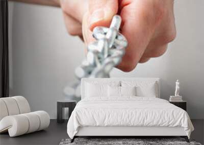 hands holding a chain. isolated on white background Wall mural