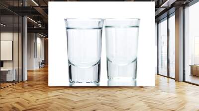 two glasses, shot glasses with liquid on a white background Wall mural