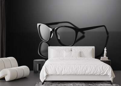 black eyeglasses reflected on shiny surface - minimalist, fashionable, style Wall mural