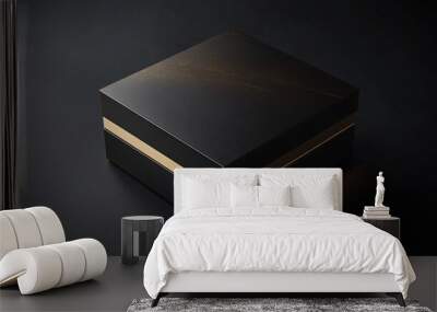 black luxury gift box with gold trim on dark background Wall mural