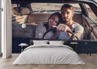 Couple with retro car Wall mural