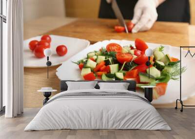 Cut the tomatoes and add them to the vegetable salad. Preparation of vegetable salad Wall mural