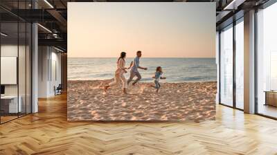 Family with dog on the beach Wall mural