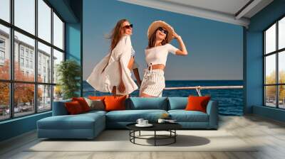 Female friends on yacht Wall mural