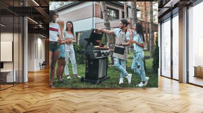 Group of friends on barbeque party Wall mural