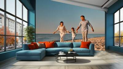 Happy family on the beach Wall mural