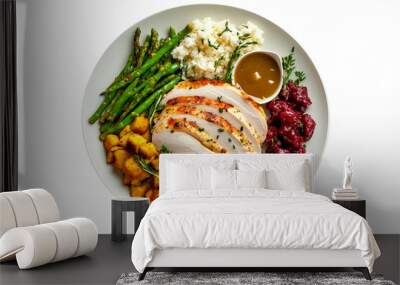 Plate of Thanksgiving dinner featuring turkey slices, roasted potatoes, cranberry sauce, mashed potatoes, and asparagus isolated on white transparent background. Concept of festive meal Wall mural