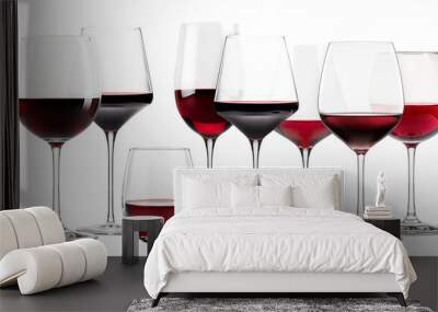 Set of red wine glasses isolated on white background. Rose wine splashing in glassware. Wall mural