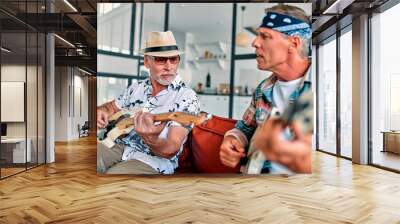 Senior friends playing guitars Wall mural