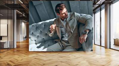 Stylish man at home Wall mural