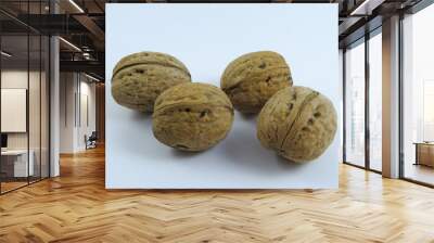 Walnuts on a white background beautiful and tasty healthy food Wall mural