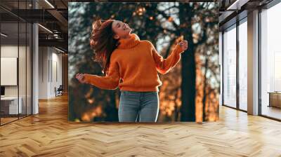 Woman in park in autumn Wall mural