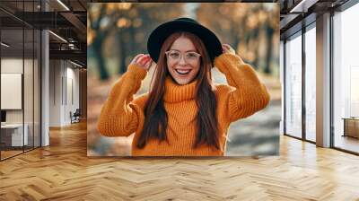 Woman in park in autumn Wall mural