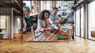 Young business people in office Wall mural