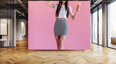 Young girl on pink background Wall mural