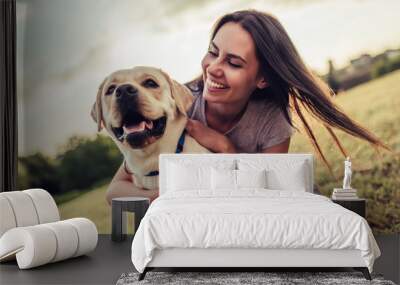 Young woman with dog Wall mural