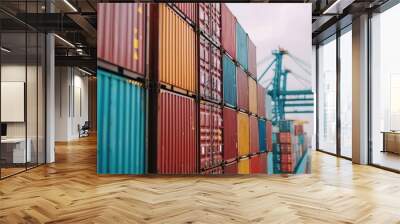 A vibrant display of stacked shipping containers at a port, highlighting the logistics and transportation industry's colorful infrastructure. Wall mural