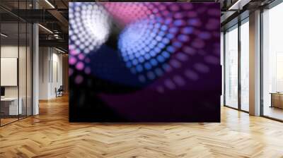 Blurred and defocused light reflections from disco ball in background. Wall mural