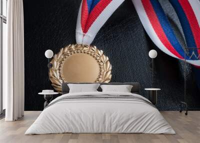 Golden medal - award for a winner on black background. Wall mural