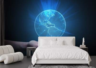 Man is holding glowing globe in hand. Global network concept. Wall mural