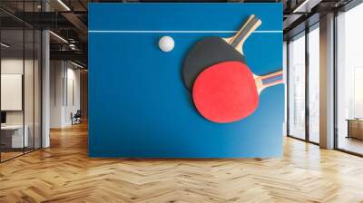 Ping pong or table tennis background with rackets Wall mural