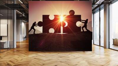 Teamwork, partnership and cooperation concept. Silhouettes of two businessman joining two pieces of puzzle together. Wall mural