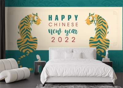 Chinese new year 2022. Lunar year of the tiger. Template banner for coming new year with ornament of flowers and waves. Two tigers sit among red oriental lanterns in retro style. Vector illustration Wall mural