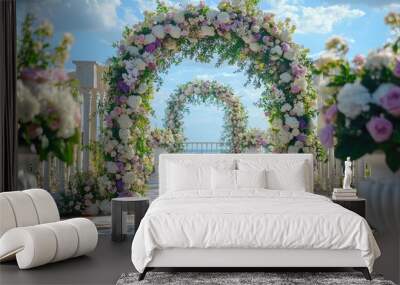 A beautifully decorated archway with floral arrangements for a wedding ceremony. Wall mural