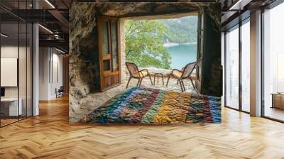 A bedroom in the cave, there is an open door with a large bed covered by a colorful quilt on which two chairs and a small table stand. The window outside Wall mural