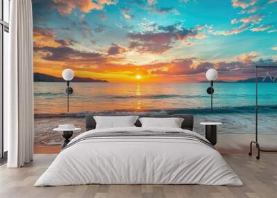 A picturesque beachside sunset, with the sun dipping below the horizon and casting vibrant colors across the sky and sea. Wall mural