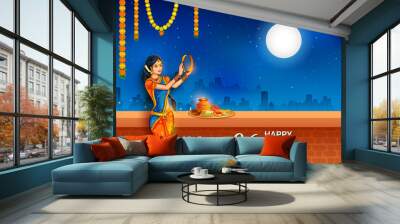 illustration of Indian woman performing Hindu married festival ritual of Karwa Cahuth looking moon through sieve Wall mural