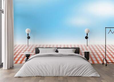 Vector picnic table covered with tablecloth on blue sky background with blurred clouds. Wall mural