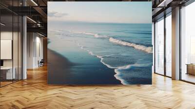 Tranquil Serenity: A Calming Image of Sea Waves Gently Caressing the Shore, Gentle waves are washing up on the beach as the sun sets over a calm ocean,  Wall mural