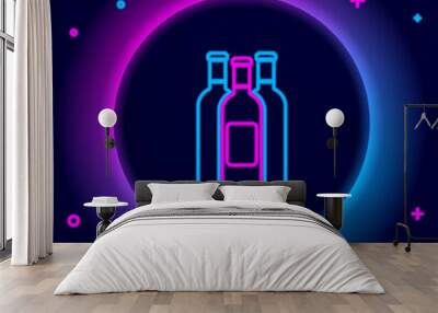 Glowing neon line Bottles of wine icon isolated on black background. Colorful outline concept. Vector. Wall mural