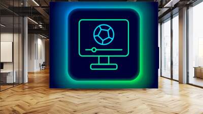 Glowing neon line Football soccer match on TV icon isolated on black background. Football online concept. Colorful outline concept. Vector Wall mural