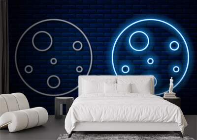 Glowing neon line Planet Mars icon isolated on brick wall background. Vector Wall mural