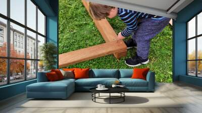 Little boy assembling furniture Wall mural