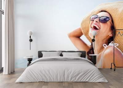  Portrait of smiling woman on the beach Wall mural