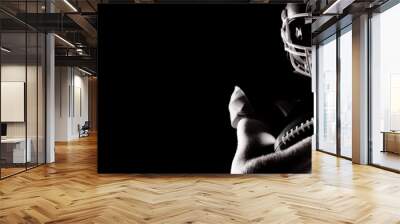 American football player in helmet holding rugby ball Wall mural