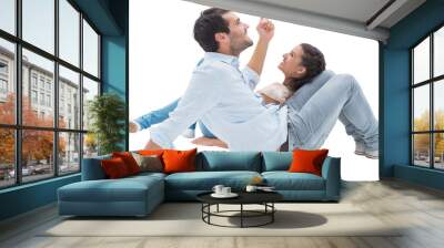 Attractive young couple lying down Wall mural