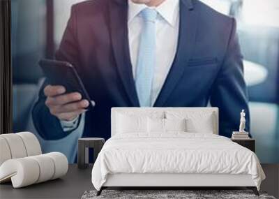 businessman looking at mobile phone Wall mural