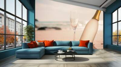 champagne bottle and two glasses on sand Wall mural