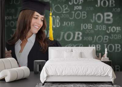 Composite image of a smiling woman with a degree Wall mural