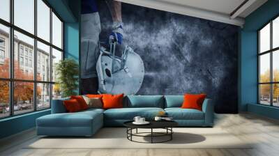 Composite image of american football player holding helmet Wall mural