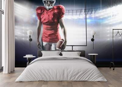 Composite image of portrait of sportsman with american football Wall mural