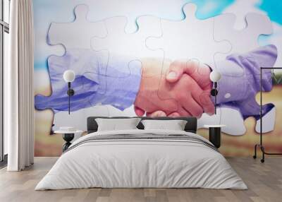 composite image of two men shaking hands Wall mural