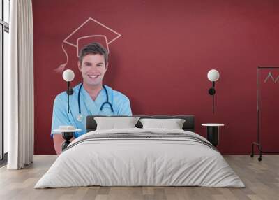 Composite image of young nurse in blue tunic with arms crossed Wall mural