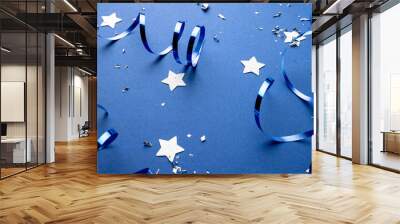 Composition of close up of new years decorations on blue background Wall mural